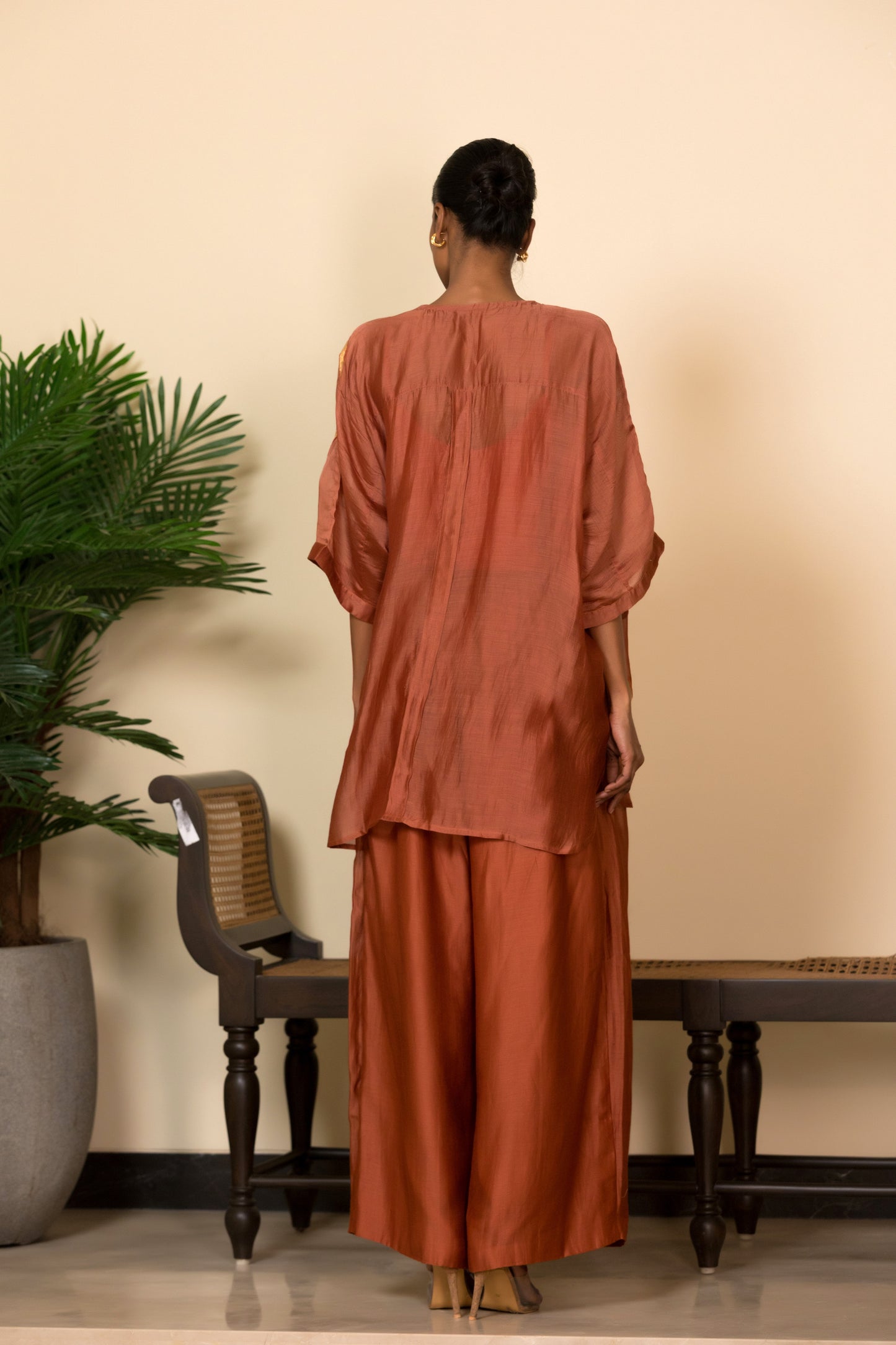 Back view of Rust kaftan coord set for women with banarasi patch by luxury designer Eeda