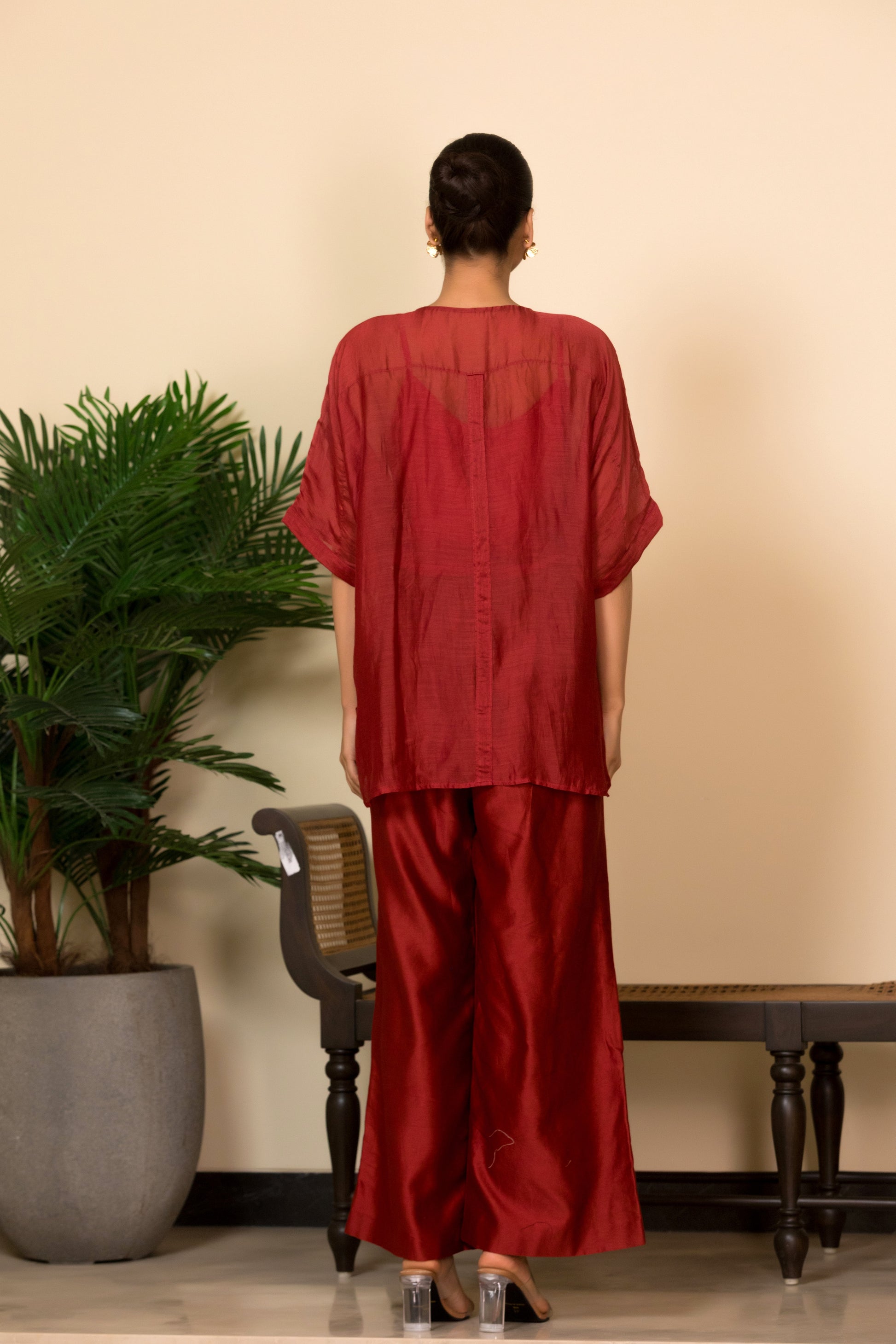 Back View of Red banarasi coord set in silk chanderi with asymmetrical patchwork for women, sober designer wear