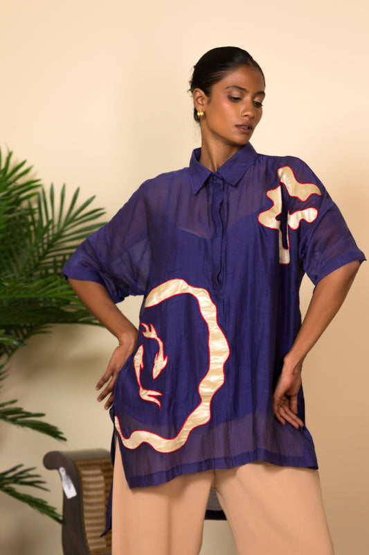 Deep purple silk women’s shirt with asymmetrical patchwork, styled with beige wide pants, luxury Indo western outfit by EEDA India