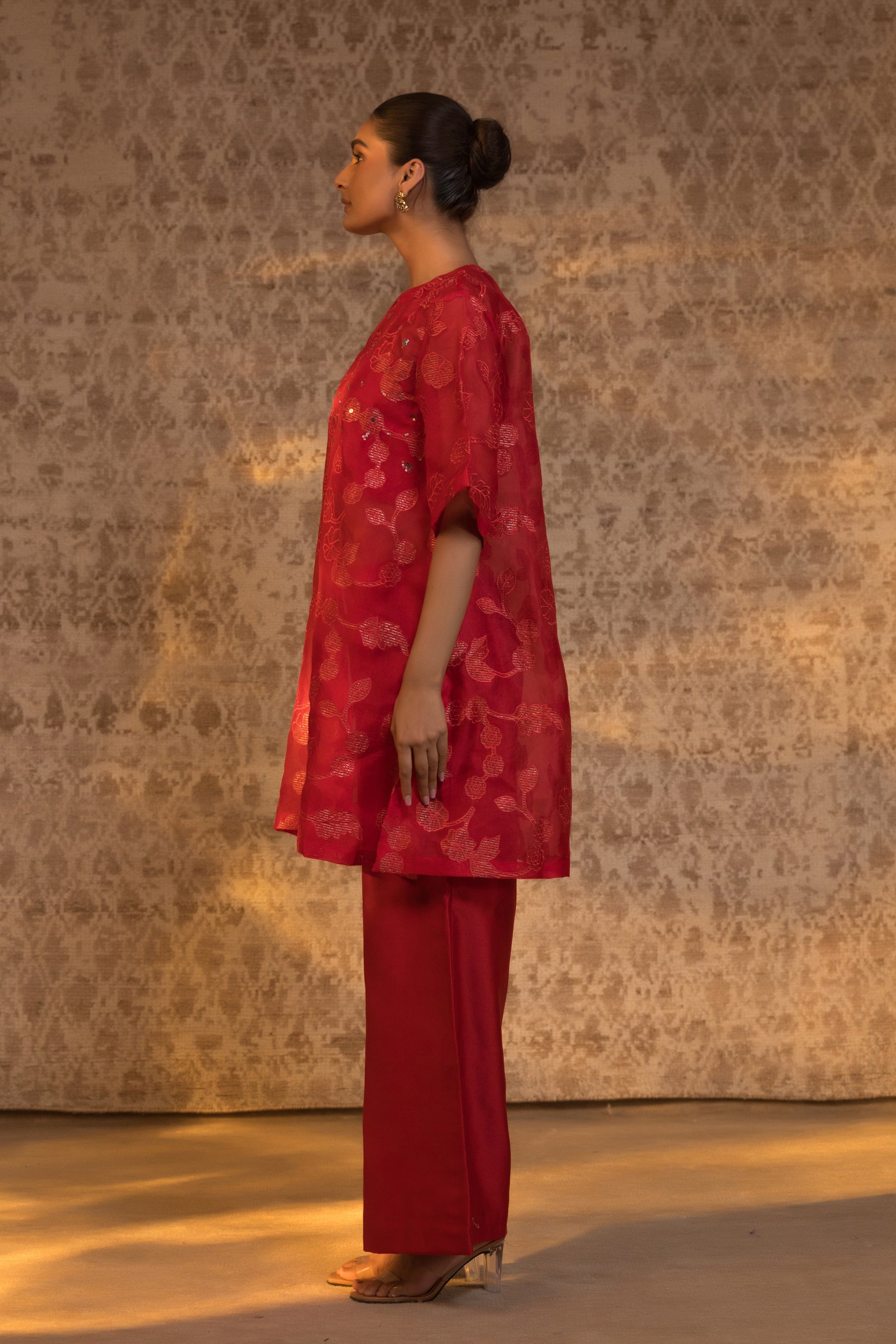 Side view of red organza kurta set showcasing its elegant design