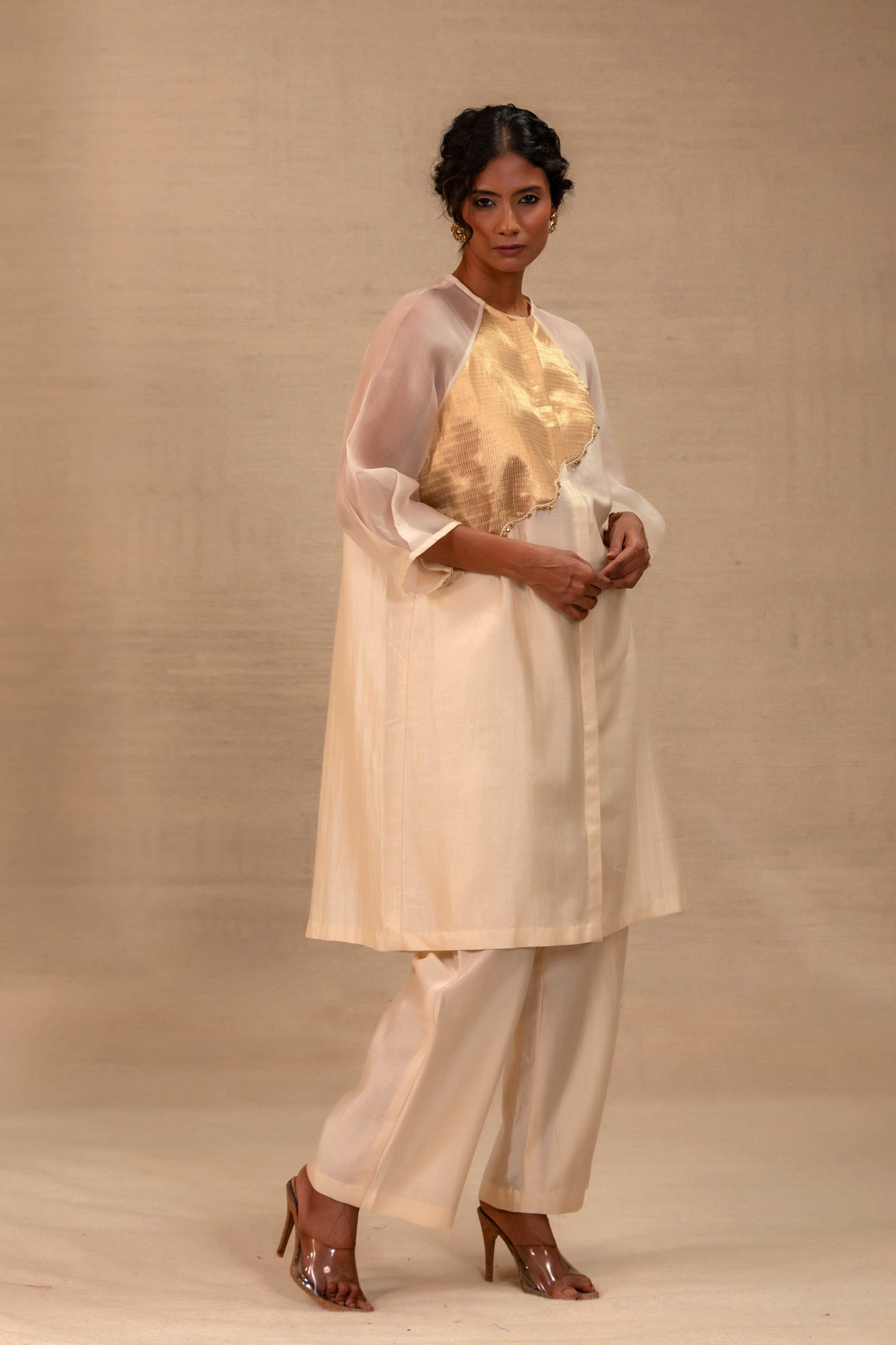 Model in an ivory Chanderi kurta set with a gold tissue patch and pants — Eeda Spotlight