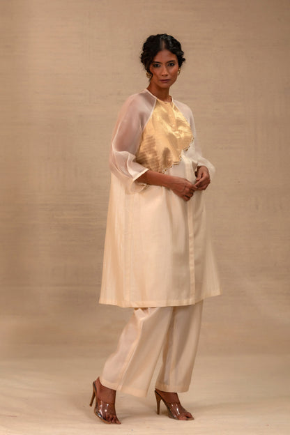 Model in an ivory Chanderi kurta set with a gold tissue patch and pants — Eeda Spotlight
