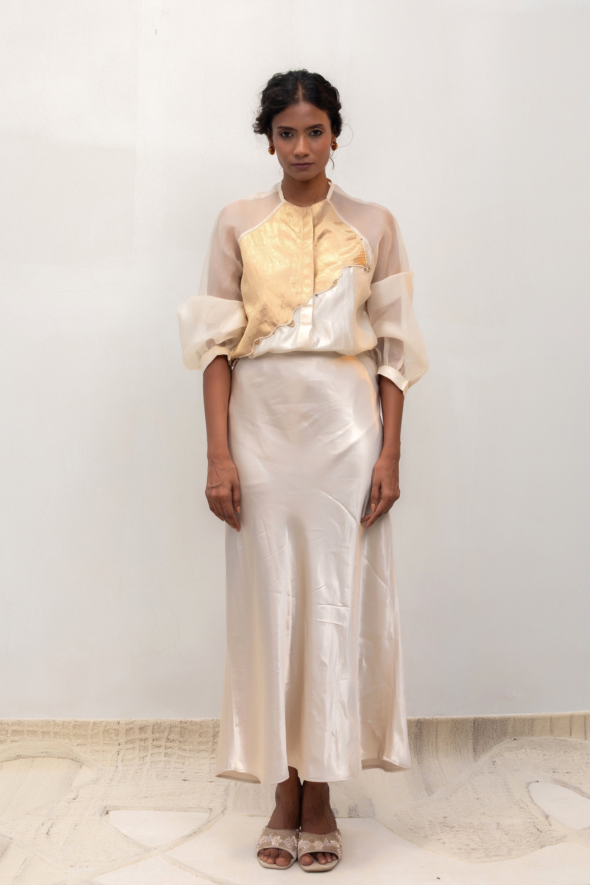 Ivory silk shirt with a gold tissue-brocade patch, styled with a skirt — Eeda