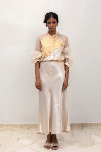 Ivory silk shirt with a gold tissue-brocade patch, styled with a skirt — Eeda