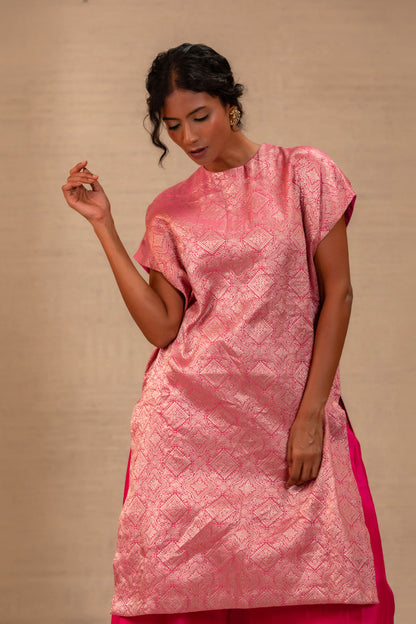Model in a pink brocade drop-shoulder kurta set with matching pants — Eeda Kinkhab