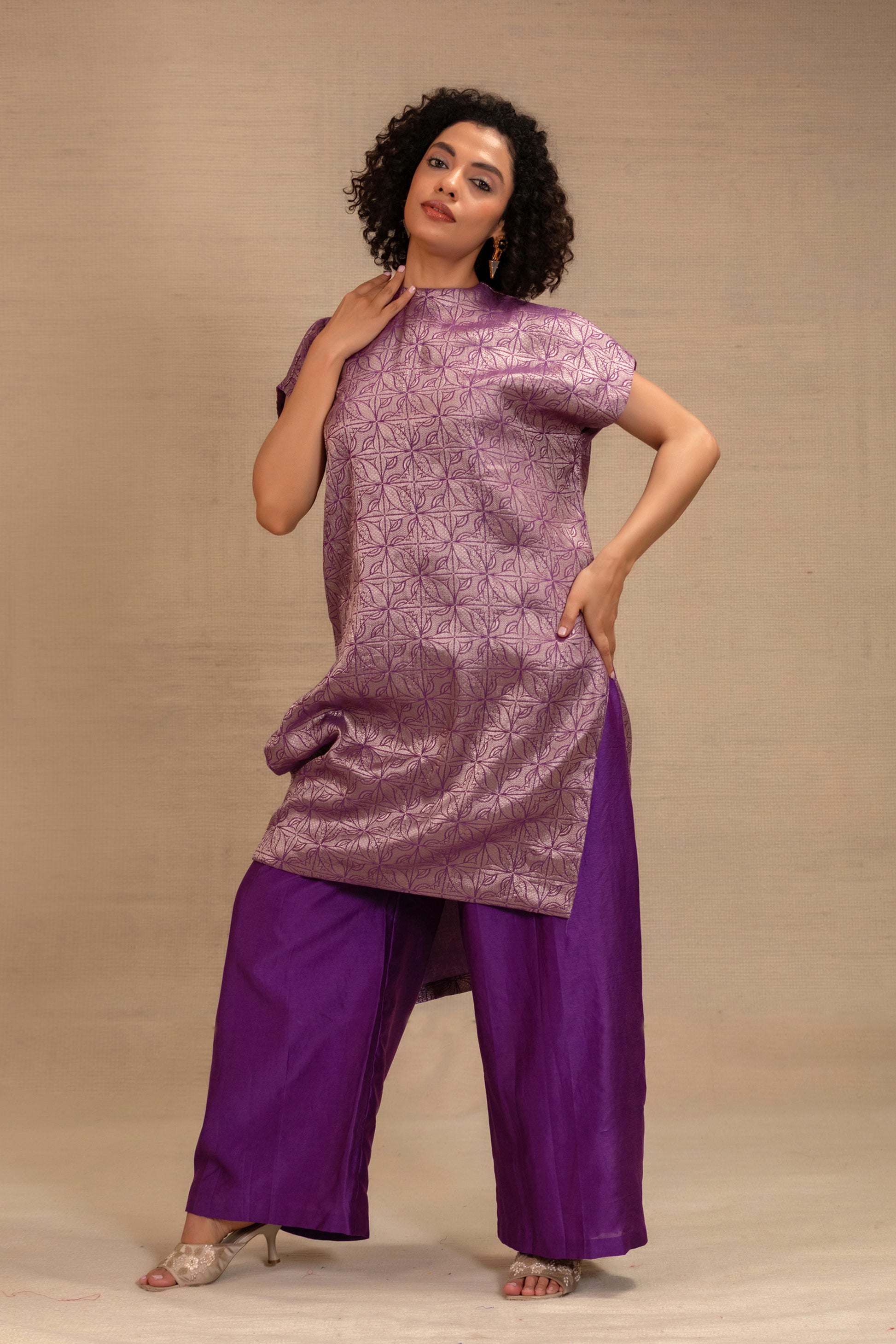 Model in a purple brocade drop-shoulder kurta set with matching pants — Eeda Kinkhab