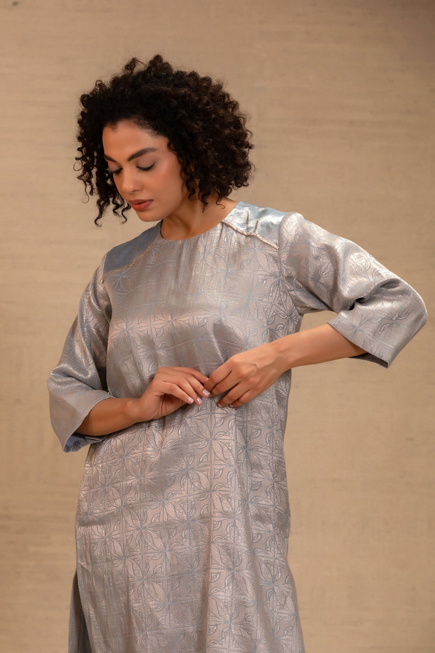 Model in a soft blue brocade long kurta set with tissue detailing and pants — Eeda Kinkhab