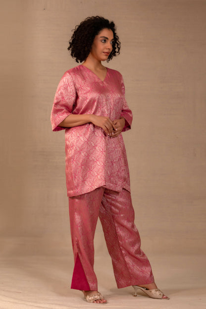 Model in a pink brocade short kurta set with matching pants — Eeda Kinkhab