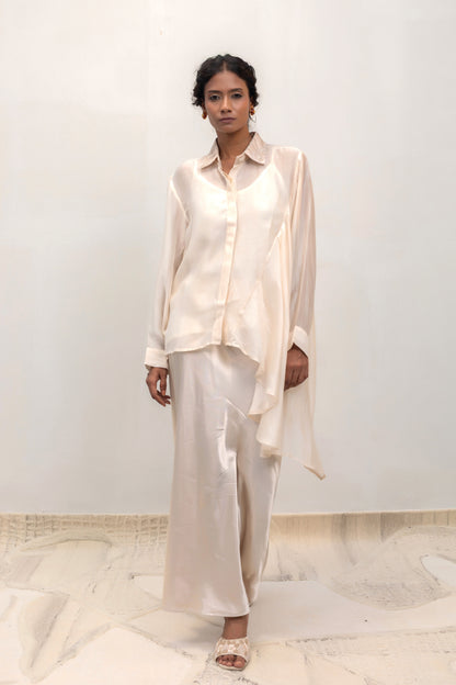 Ivory high-low shirt with an embellished collar, styled with trousers — Eeda