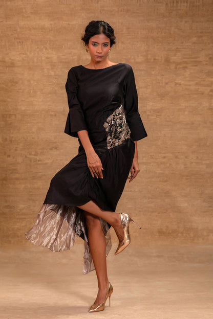Model in a black side-gather high-low dress with tissue hem — Eeda