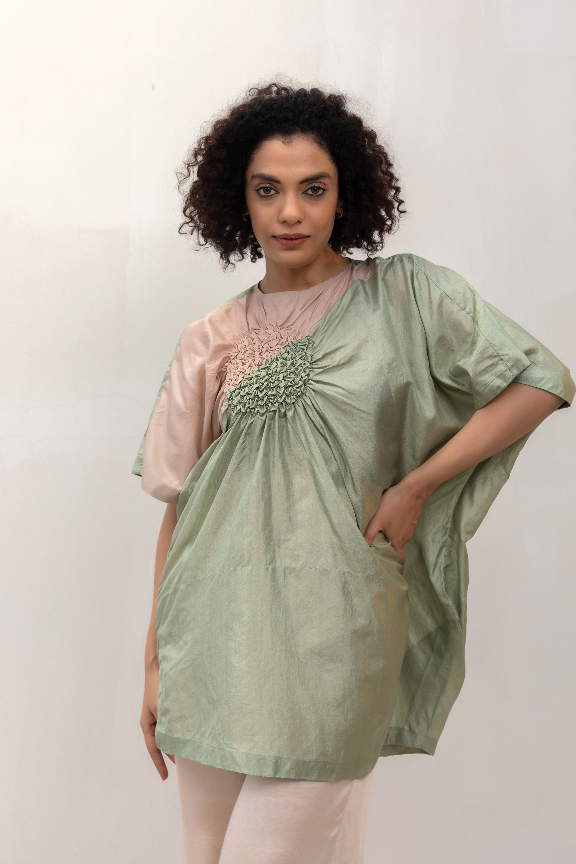 Contemporary pista-green silk tunic top with smocking, relaxed fit — Eeda Varq