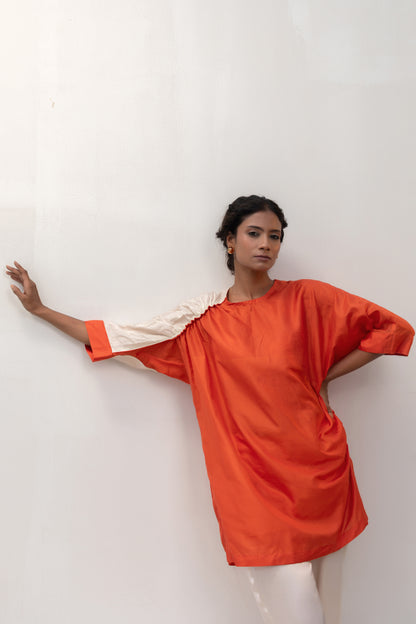 Vibrant orange silk tunic with subtle metallic sleeve detail — Eeda Varq