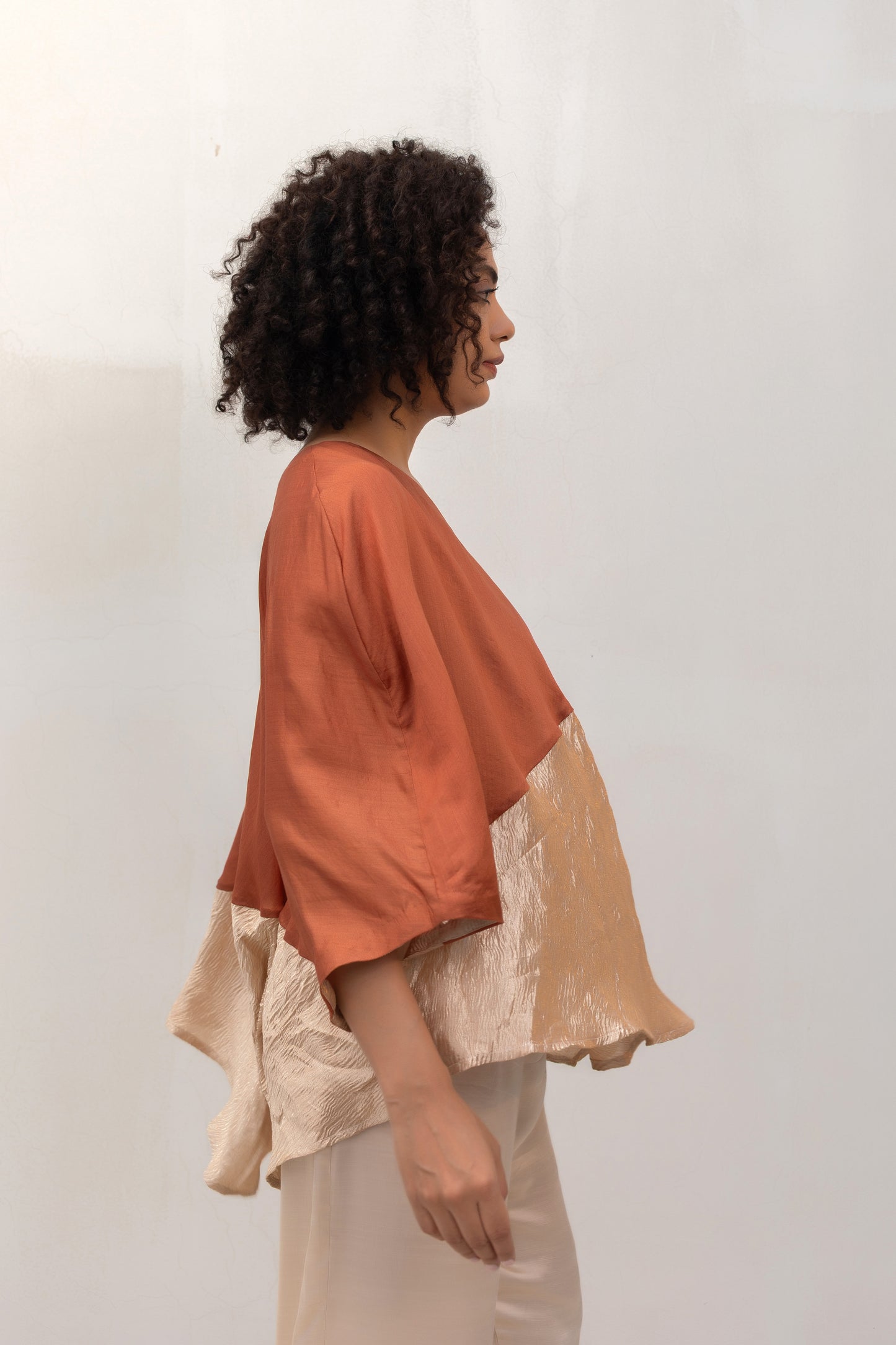 Model in a Brown Varq Horizon Top styled with pants — Eeda
