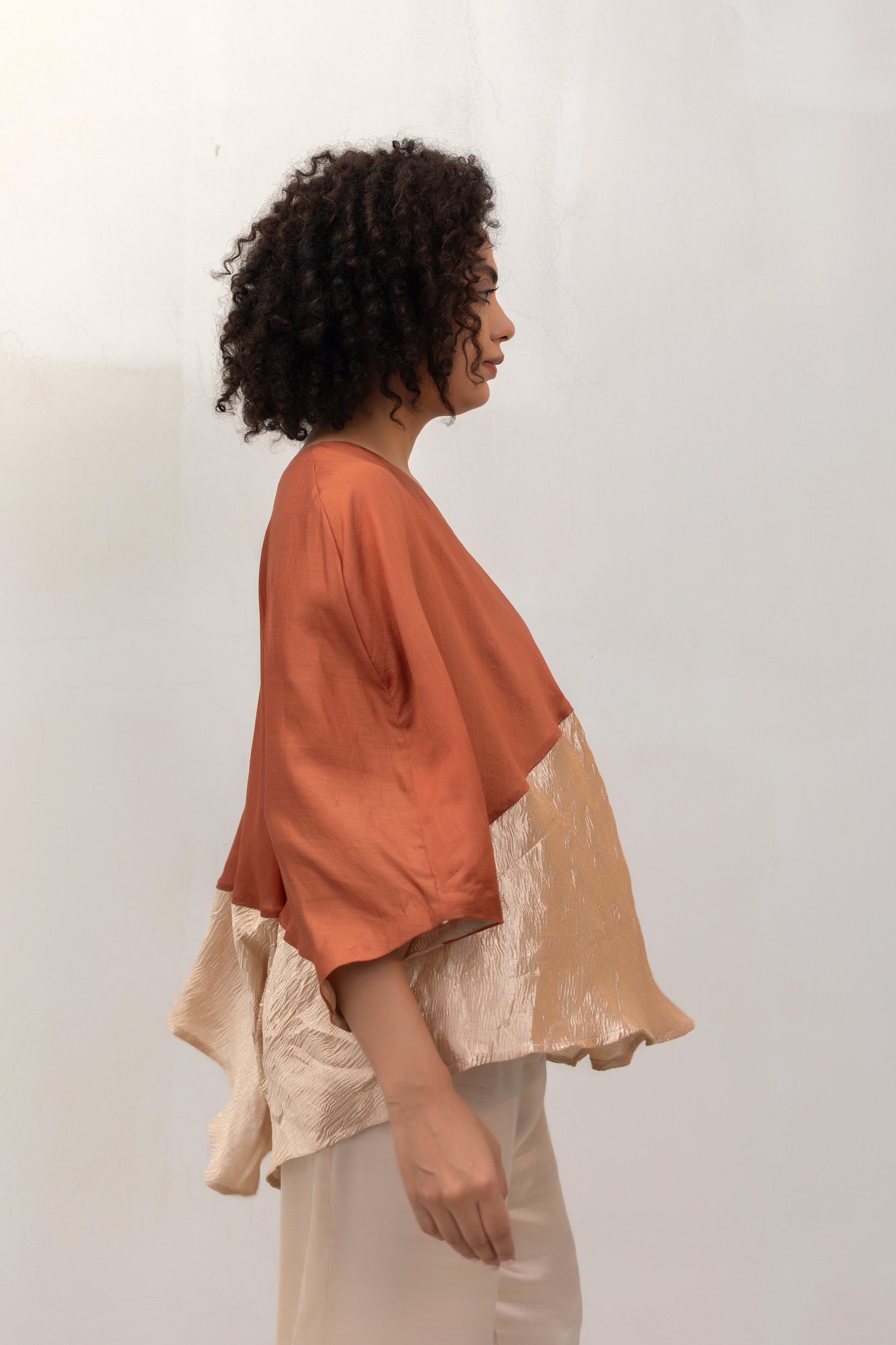 Model in a Brown Varq Horizon Top styled with pants — Eeda