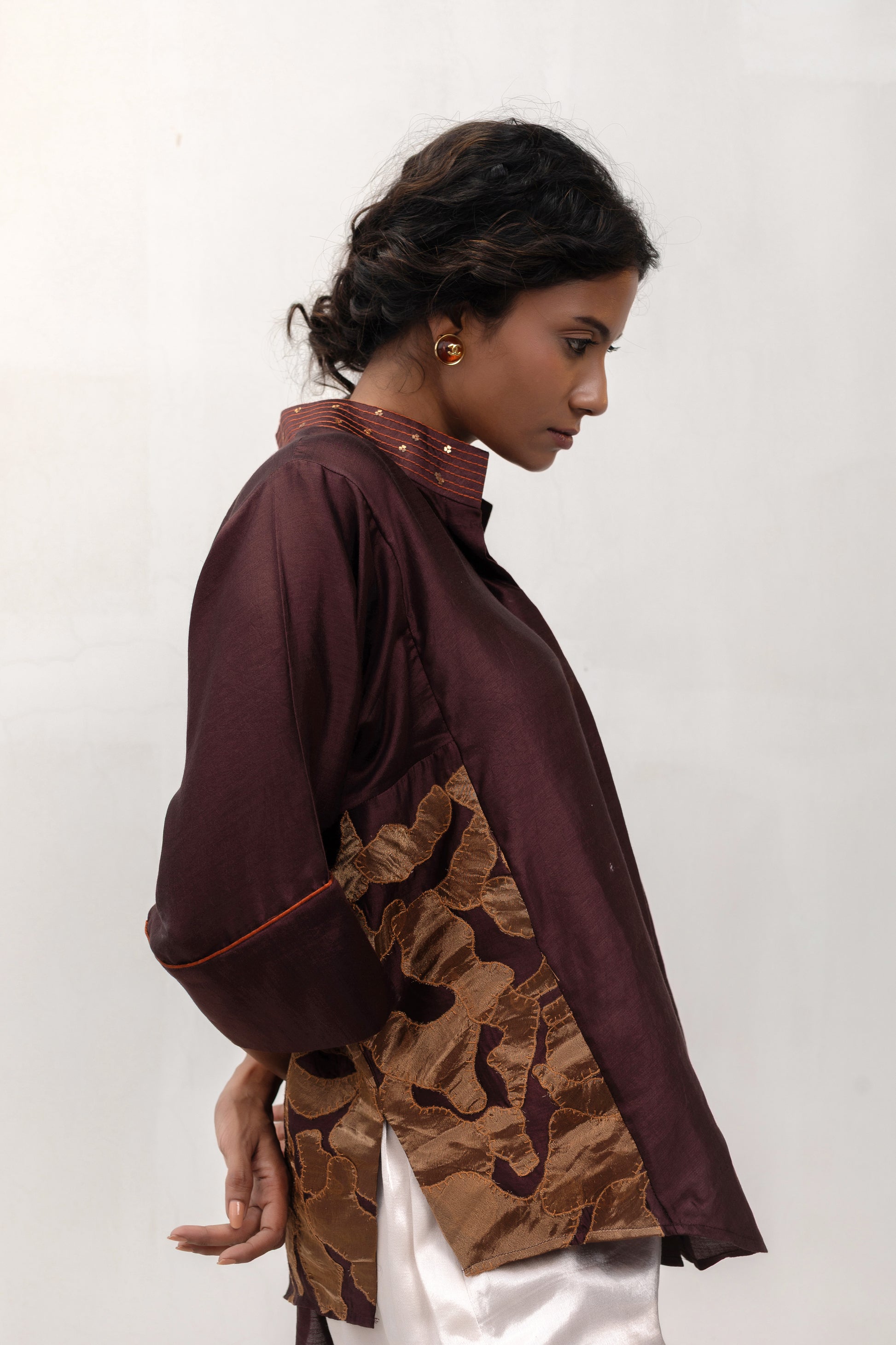 Model in an brwon Varq Vine Shirt styled with pants — Eeda