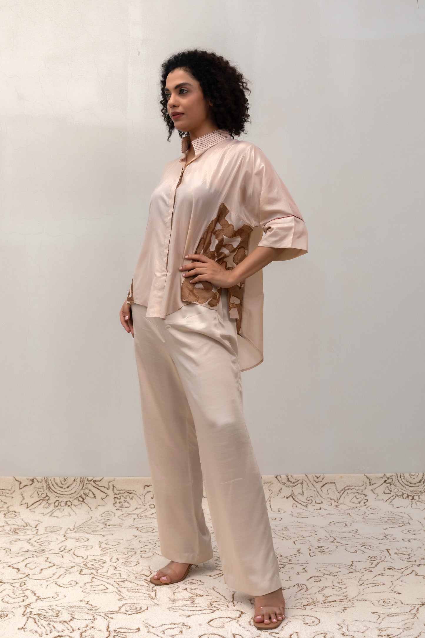 Model in an offwhite Varq Vine Shirt styled with pants — Eeda