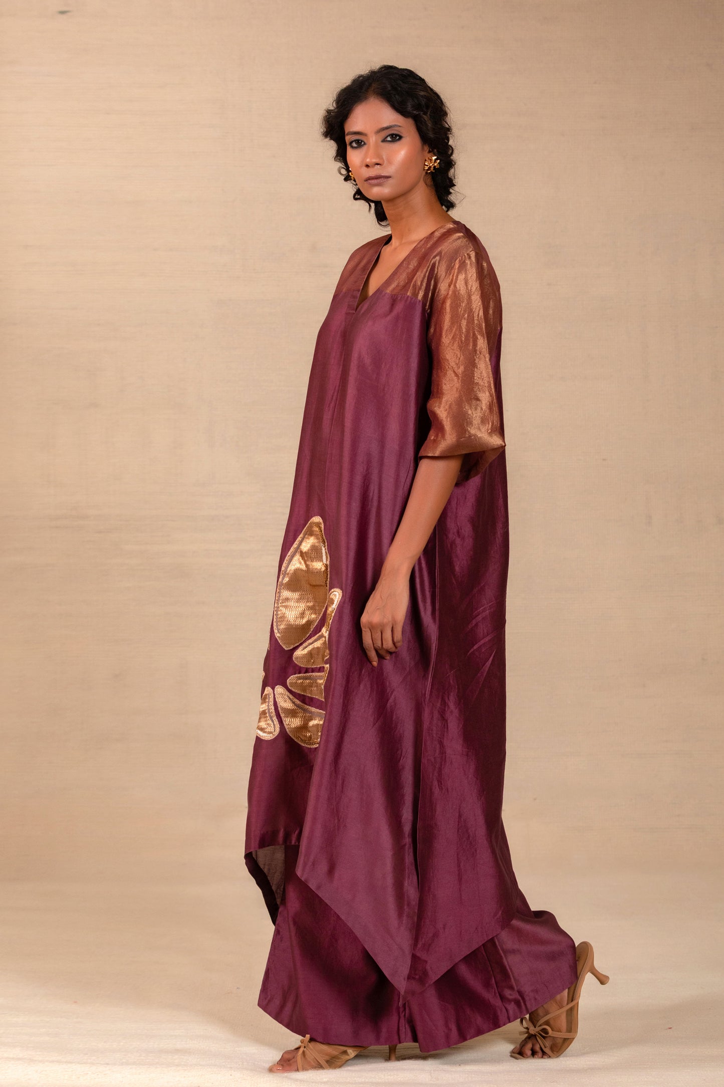 Model in a winelong kurta set with tissue yoke and matching pants — Eeda Gulnaar