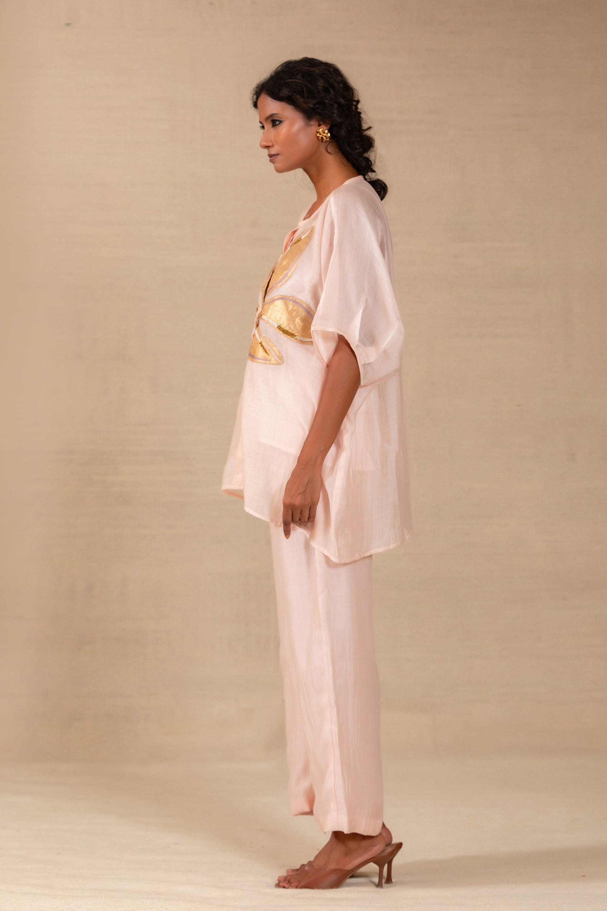 Model in a Pink silk-Chanderi drop-shoulder co-ord set with gold leaf appliqué — Eeda Gulnaar