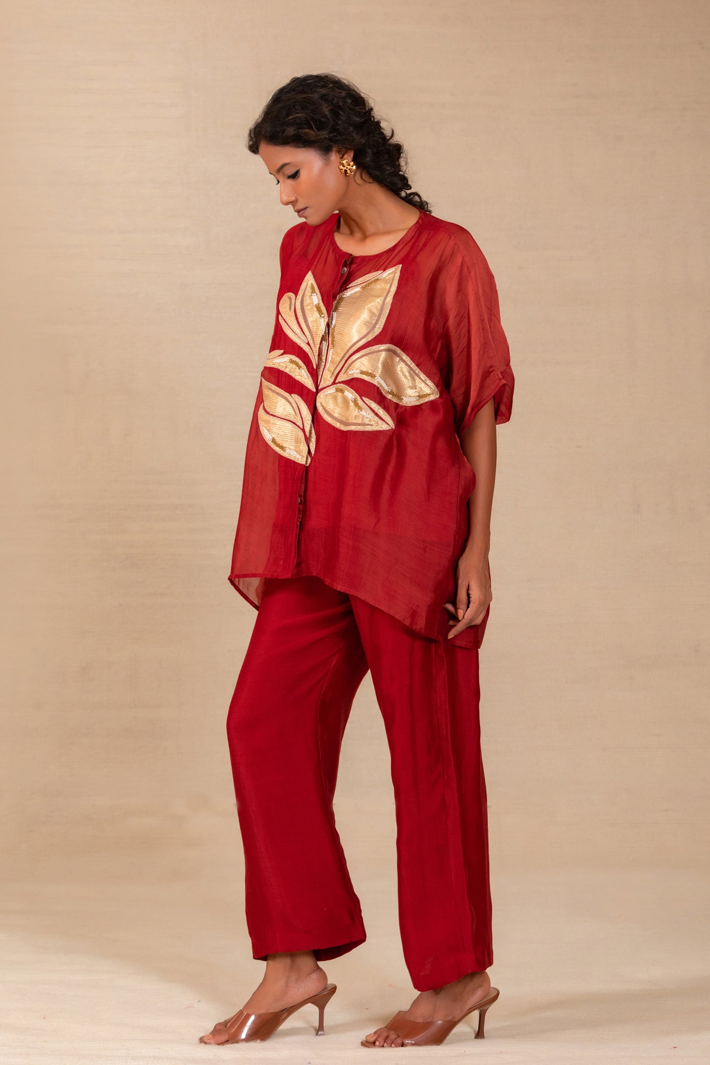 Model in a maroon silk-Chanderi drop-shoulder co-ord set with gold leaf appliqué — Eeda Gulnaar