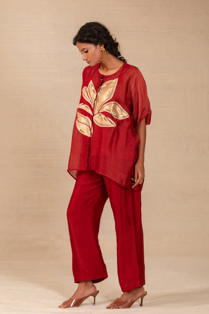 Model in a maroon silk-Chanderi drop-shoulder co-ord set with gold leaf appliqué — Eeda Gulnaar