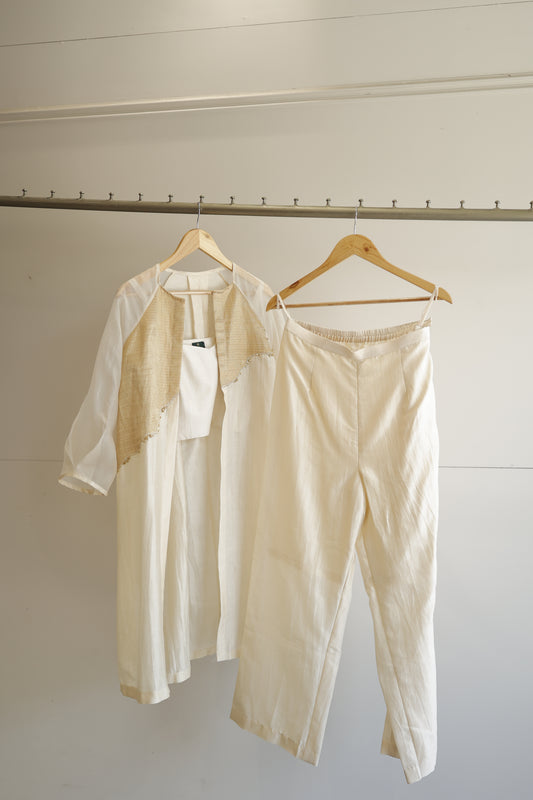 eeda ivory chanderi silk kurta with asymmetrical gold tissue patchwork panel and bishop sleeves, front view, handcrafted in Varanasi