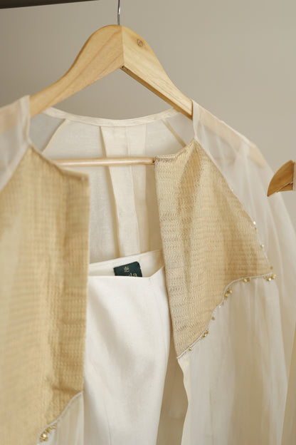 eeda ivory chanderi kurta set with gold silk tissue patchwork, side view showing relaxed silhouette and gathered cuff detail