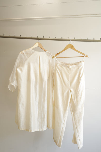 eeda ivory chanderi silk kurta set with gold tissue patchwork, paired with straight ivory chanderi trousers