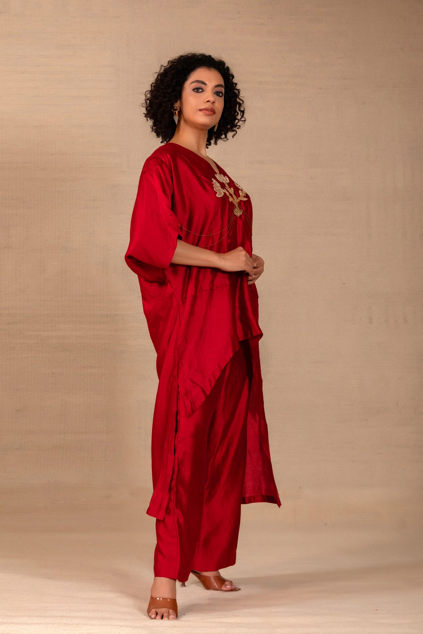 Model in an maroon kaftan-style silk kurta set with folk motif and silk pants — Eeda Silsila