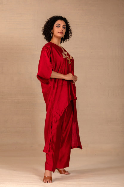 Model in an maroon kaftan-style silk kurta set with folk motif and silk pants — Eeda Silsila