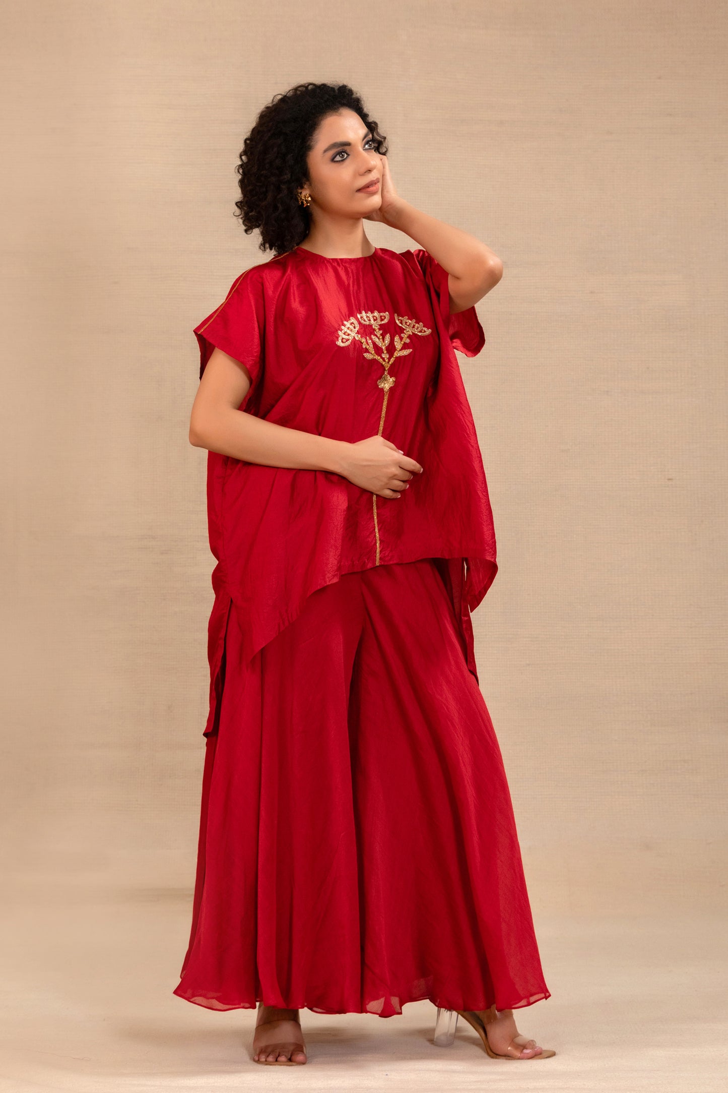 Model in a red kaftan tunic set with wide silk palazzos — Eeda Silsila