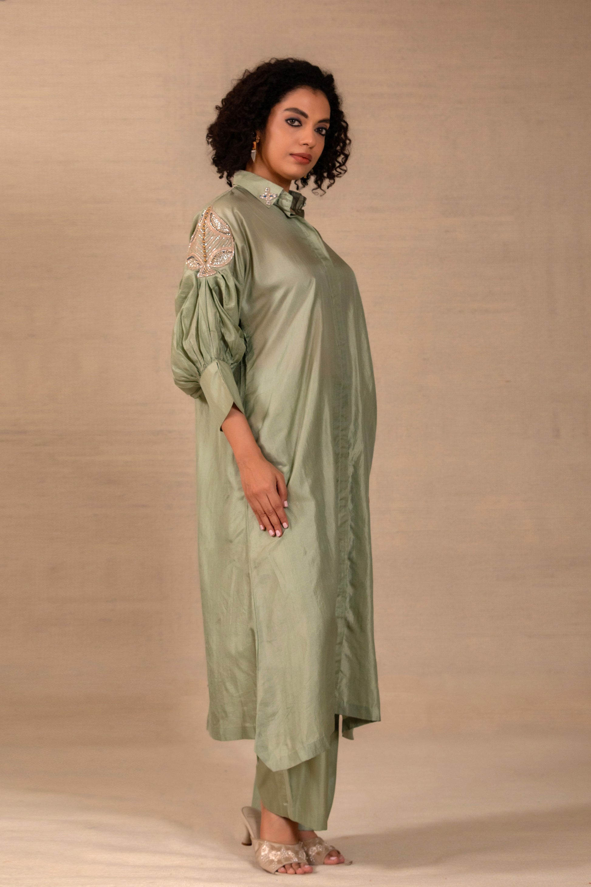 Model in a sage silk kurta set with a placed side motif and straight silk pants — Eeda Silsila