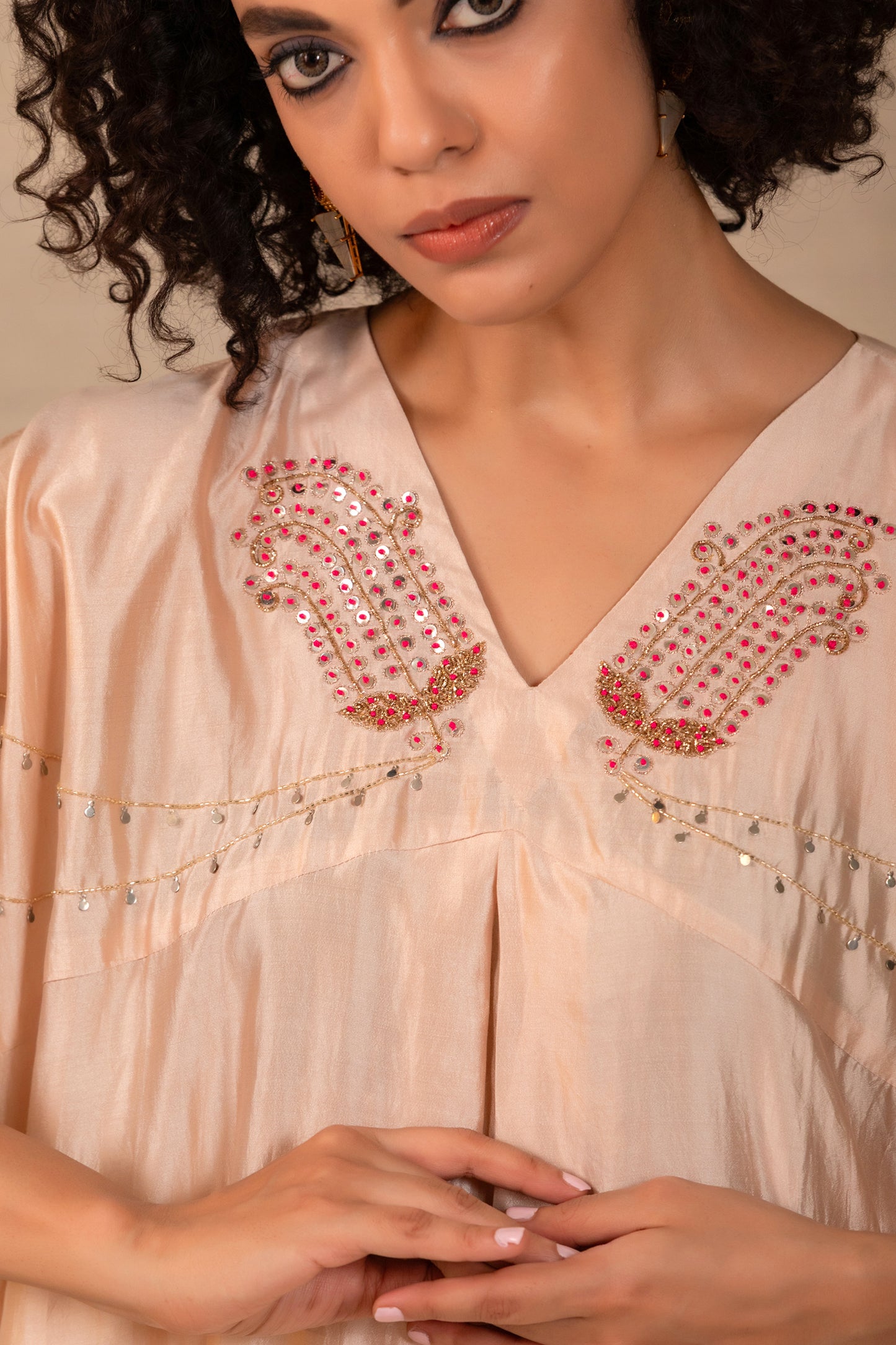 Model in an ivory paisley kaftan set with side cowls and silk pants — Eeda Silsila