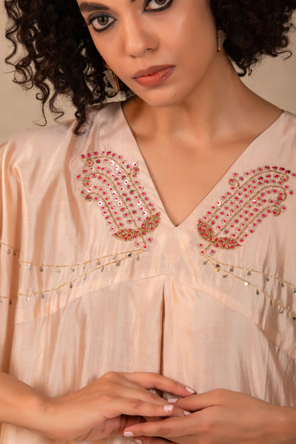 Model in an ivory paisley kaftan set with side cowls and silk pants — Eeda Silsila